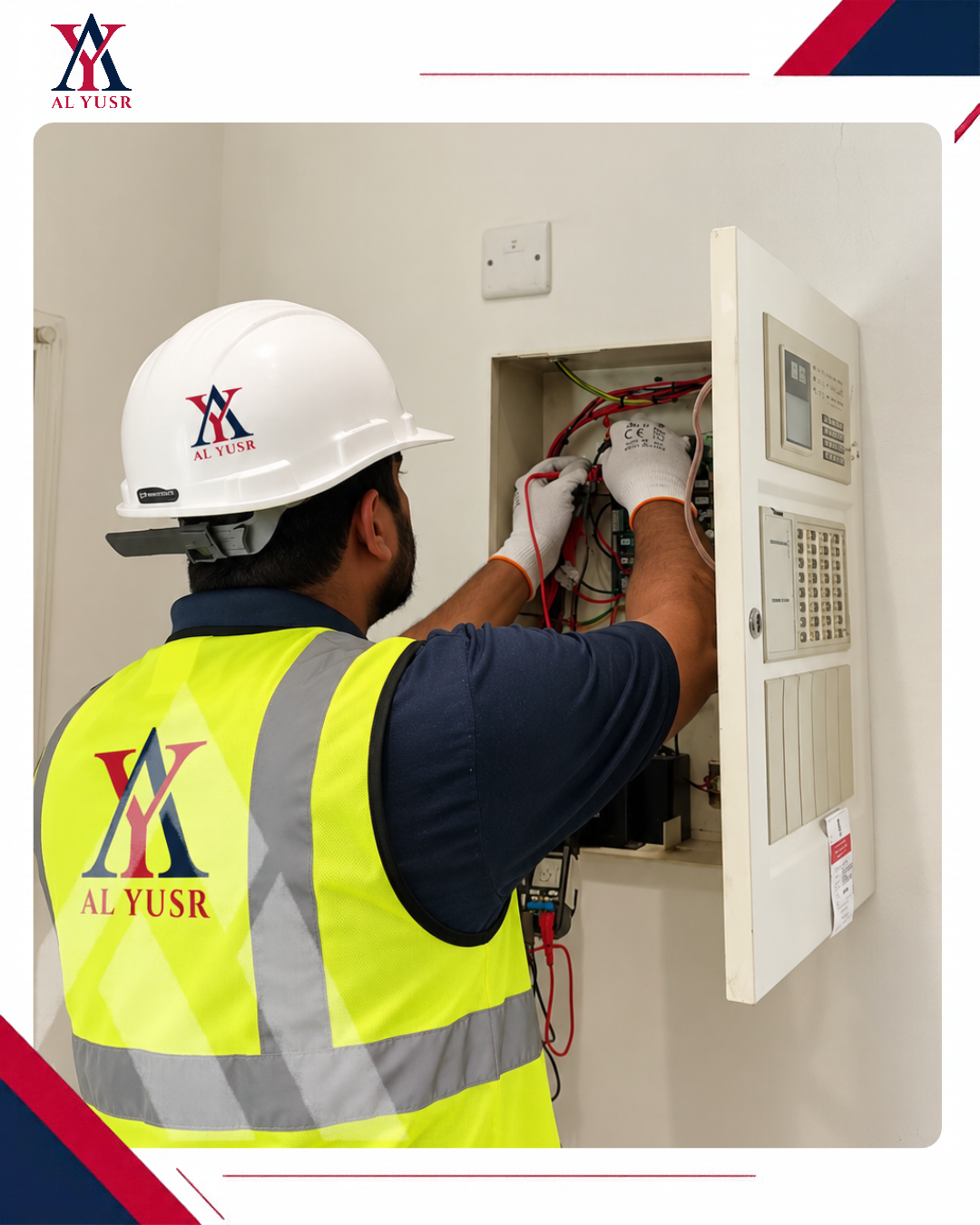Al Yusr Fire Division technician testing a fire alarm panel, fire safety services in Oman